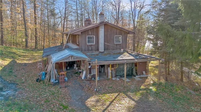 419 Glenwood Ln, Niles, NY 13021 - chalet / cabin with a chimney and board and batten siding