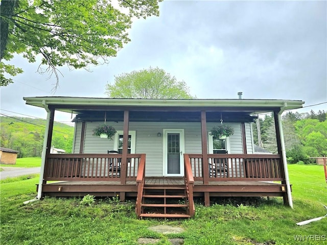 2282 Rte 305, Clarksville, NY 14727 - rear view of house featuring a yard