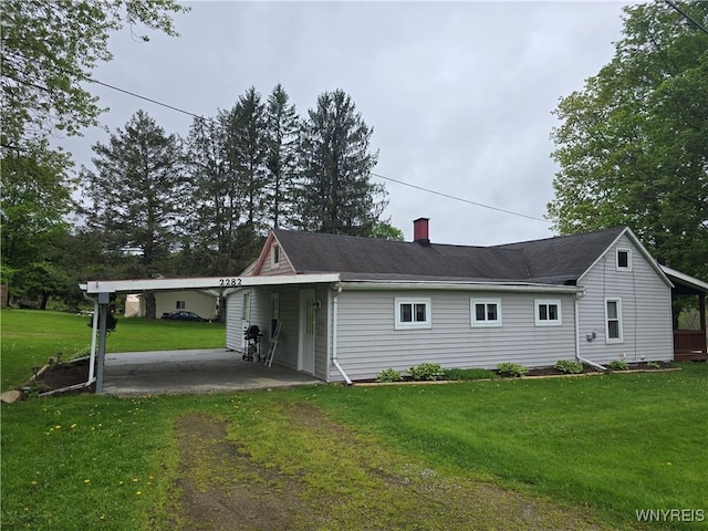 2282 Rte 305, Clarksville, NY 14727 - exterior space with a carport, a chimney, a lawn, and driveway