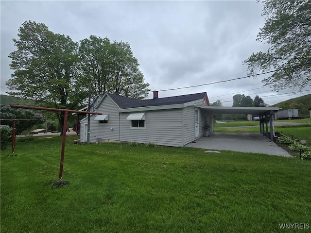 2282 Rte 305, Clarksville, NY 14727 - rear view of property with an attached carport, a yard, and a chimney