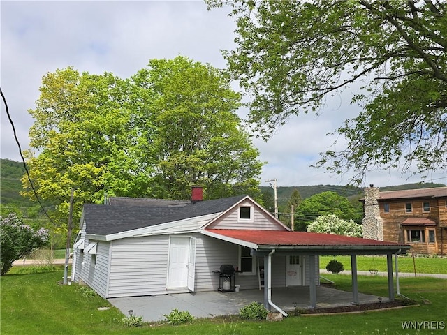 2282 Rte 305, Clarksville, NY 14727 - back of house with a lawn, a chimney, and a patio area