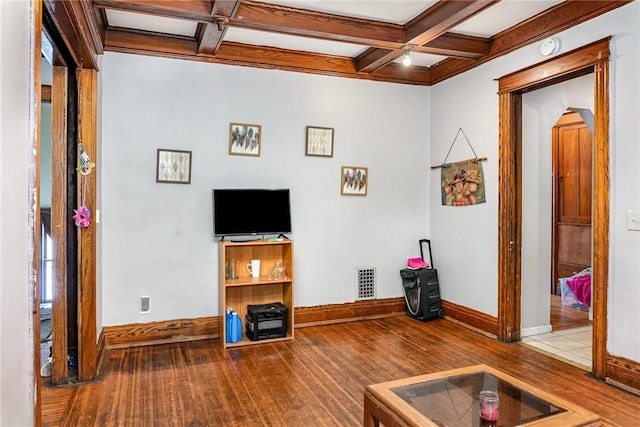 living area featuring wood-type flooring, baseboards, coffered ceiling, and beamed ceiling