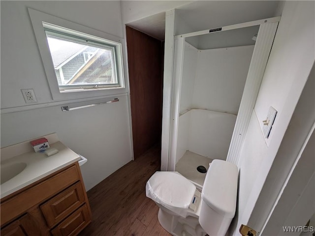 1 Shults Ave, Cohocton, NY 14826 - bathroom with a stall shower, wood finished floors, vanity, and toilet