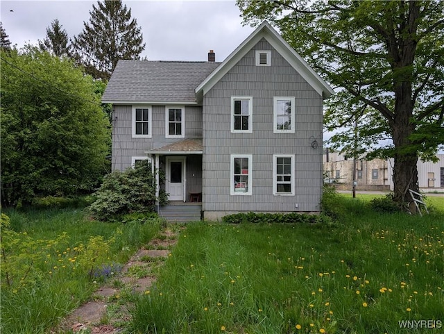 1 Shults Ave, Cohocton, NY 14826 - view of front facade featuring a shingled roof and a chimney