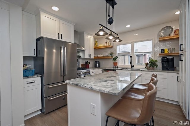 3912 Seneca St Unit 1, West Seneca, NY 14224 - kitchen featuring appliances with stainless steel finishes, open shelves, a sink, dark wood-type flooring, and recessed lighting