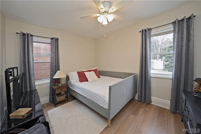 3912 Seneca St Unit 1, West Seneca, NY 14224 - bedroom with light wood-style flooring, baseboards, and ceiling fan