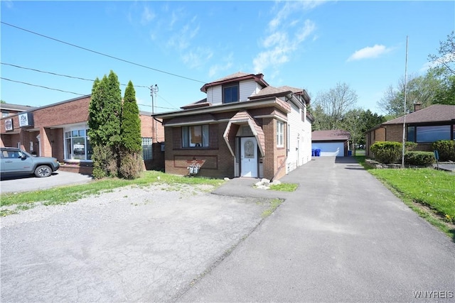 3912 Seneca St Unit 1, West Seneca, NY 14224 - view of front of house featuring brick siding and a detached garage