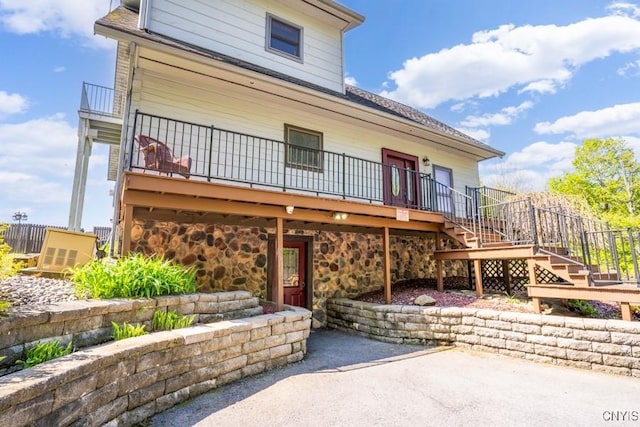 240 Mucky Run Rd, Frankfort, NY 13340 - view of front of property with stairway, a patio, stone siding, and a deck