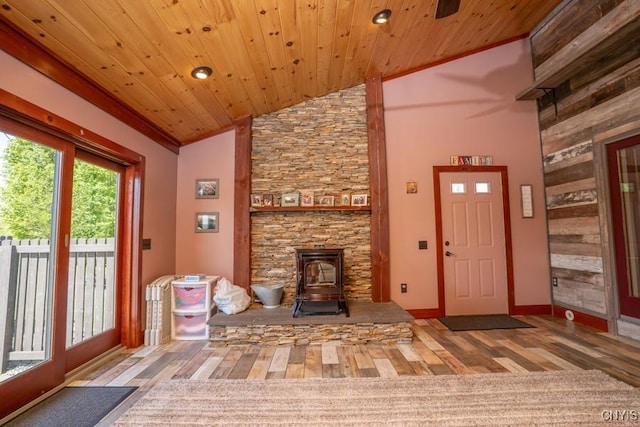 240 Mucky Run Rd, Frankfort, NY 13340 - foyer entrance with a wood stove, wood finished floors, wooden ceiling, baseboards, and high vaulted ceiling