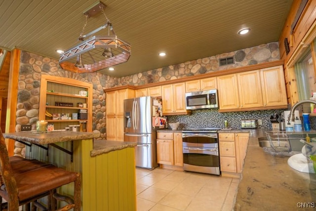 240 Mucky Run Rd, Frankfort, NY 13340 - kitchen featuring stainless steel appliances, a sink, decorative backsplash, a kitchen breakfast bar, and light brown cabinets