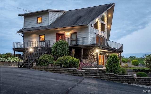 240 Mucky Run Rd, Frankfort, NY 13340 - contemporary house with stairs, stone siding, roof with shingles, and covered porch