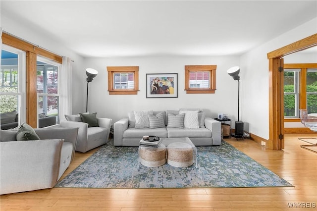 living area with wood finished floors and baseboards