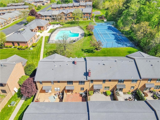 aerial perspective of suburban area featuring a pool area