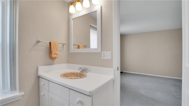 bathroom featuring vanity and baseboards