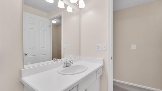 bathroom featuring vanity and baseboards