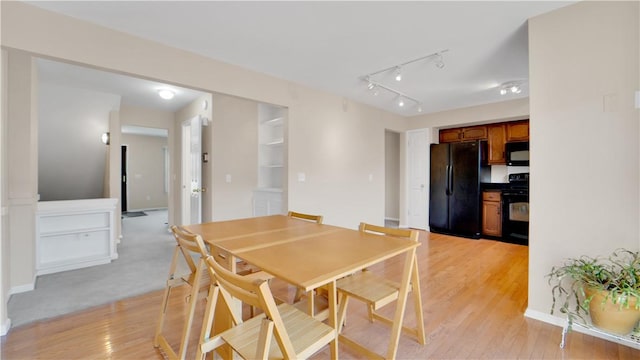 dining area with light wood-style floors