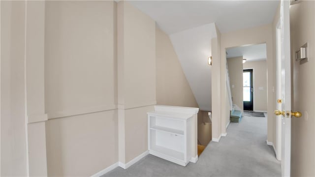 hall with carpet and baseboards