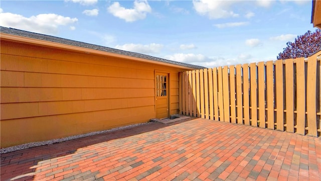 view of patio featuring fence