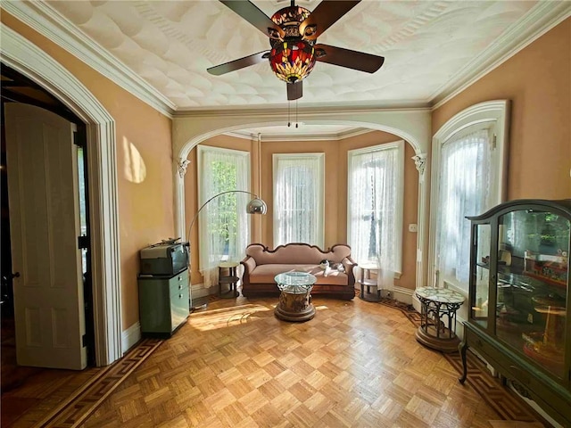 440 Park Ave, Barton, NY 14892 - living area with arched walkways, ceiling fan, baseboards, and ornamental molding