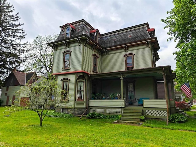 440 Park Ave, Barton, NY 14892 - victorian home featuring mansard roof, a porch, and a front yard