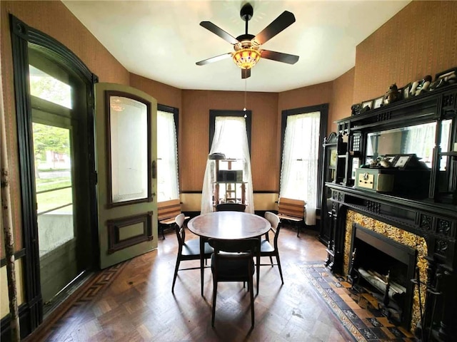 440 Park Ave, Barton, NY 14892 - dining room featuring ceiling fan, a fireplace, and healthy amount of natural light