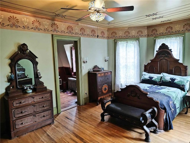 440 Park Ave, Barton, NY 14892 - bedroom with radiator, wood finished floors, crown molding, and a ceiling fan