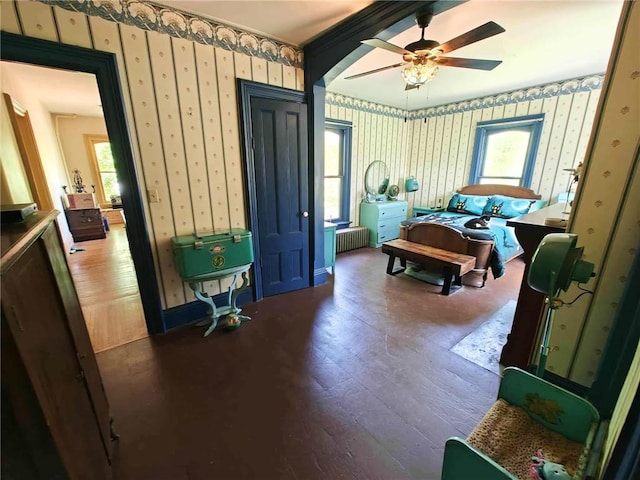 440 Park Ave, Barton, NY 14892 - bedroom featuring wallpapered walls, hardwood / wood-style flooring, radiator, and ceiling fan