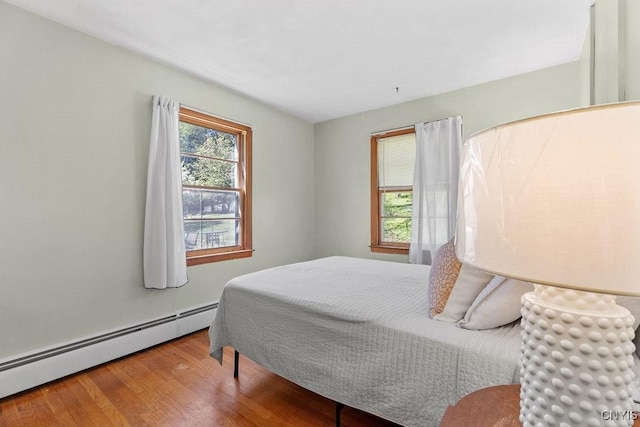 10 S Ten Eyck Ave, Cazenovia, NY 13035 - bedroom with baseboard heating and wood finished floors