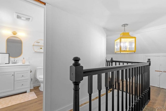 10 S Ten Eyck Ave, Cazenovia, NY 13035 - hall featuring an upstairs landing and wood finished floors