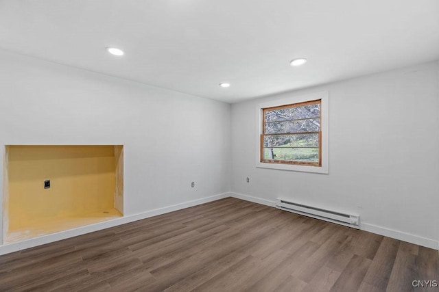 10 S Ten Eyck Ave, Cazenovia, NY 13035 - empty room with a baseboard radiator, wood finished floors, recessed lighting, and baseboards