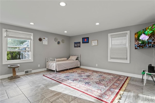bedroom featuring recessed lighting and baseboards