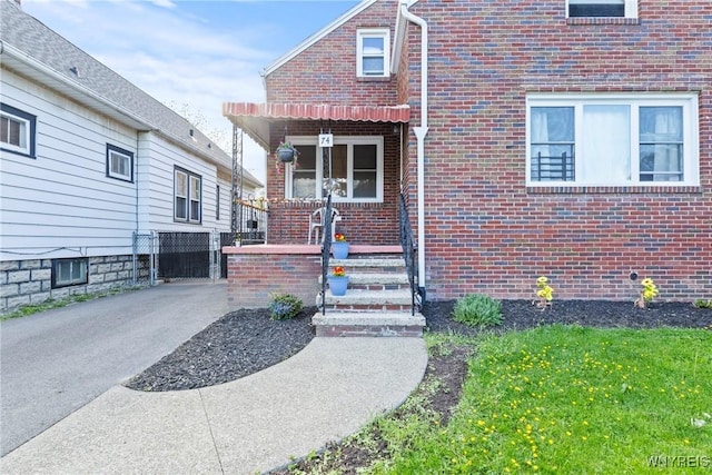 entrance to property with brick siding