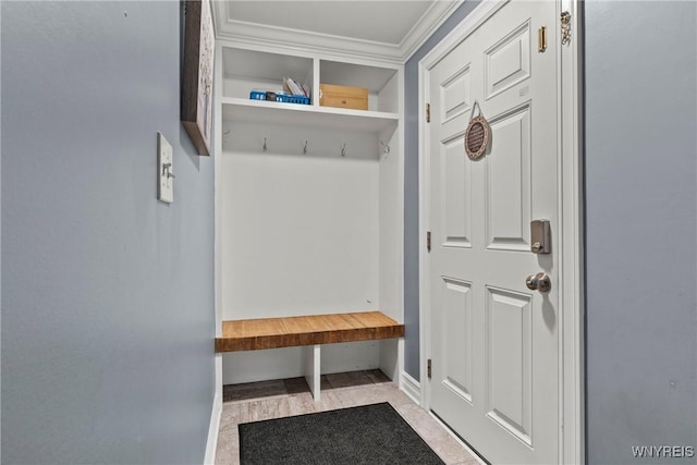 mudroom featuring ornamental molding and baseboards