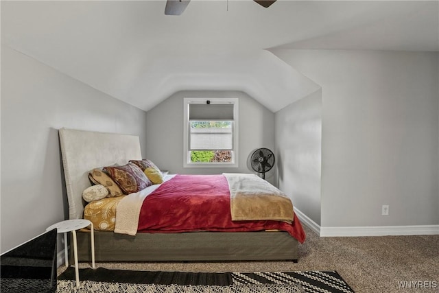 carpeted bedroom with lofted ceiling, baseboards, and a ceiling fan