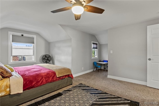 bedroom featuring lofted ceiling, carpet, baseboards, and a ceiling fan