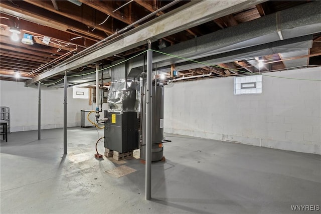 below grade area featuring heating unit