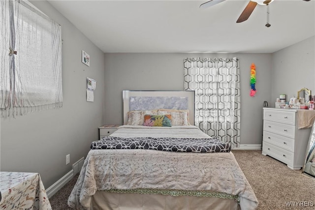bedroom with carpet, a ceiling fan, and baseboards