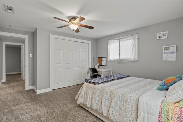 bedroom featuring carpet, a closet, a ceiling fan, and baseboards