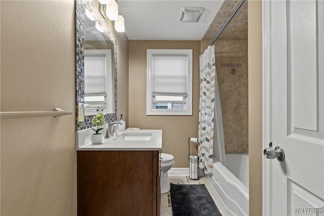 full bath with toilet, vanity, and shower / tub combo