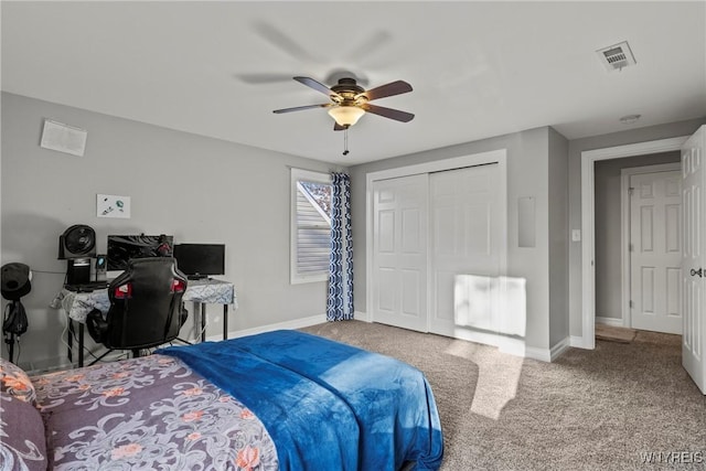 bedroom with carpet floors, baseboards, a ceiling fan, and a closet