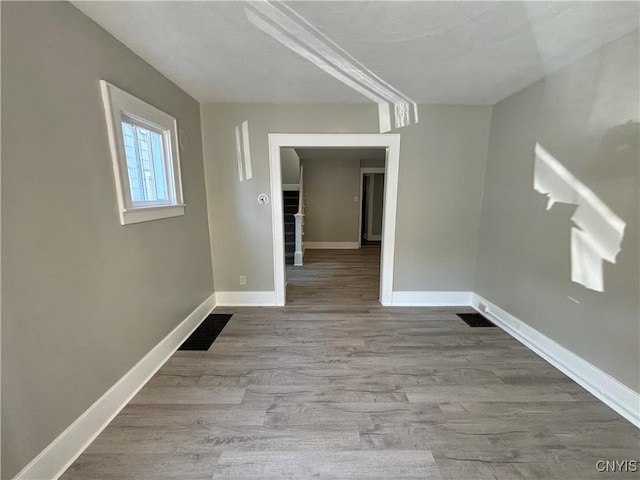 214 Herriman St Unit 216, Syracuse, NY 13204 - spare room with wood finished floors and baseboards