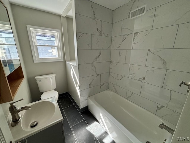 214 Herriman St Unit 216, Syracuse, NY 13204 - bathroom with marble look tile flooring, toilet, vanity, baseboards, and shower / bathtub combination