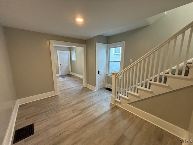 214 Herriman St Unit 216, Syracuse, NY 13204 - entryway with baseboards, wood finished floors, stairs, and recessed lighting