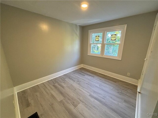 214 Herriman St Unit 216, Syracuse, NY 13204 - spare room featuring wood finished floors, baseboards, and recessed lighting