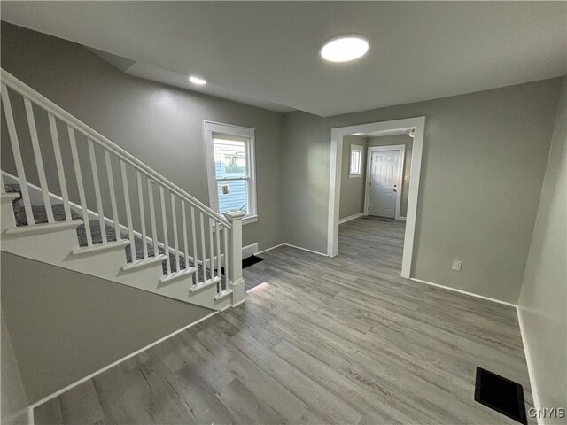 214 Herriman St Unit 216, Syracuse, NY 13204 - staircase featuring wood finished floors and baseboards