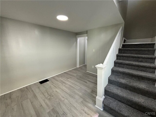 214 Herriman St Unit 216, Syracuse, NY 13204 - staircase featuring wood finished floors and baseboards