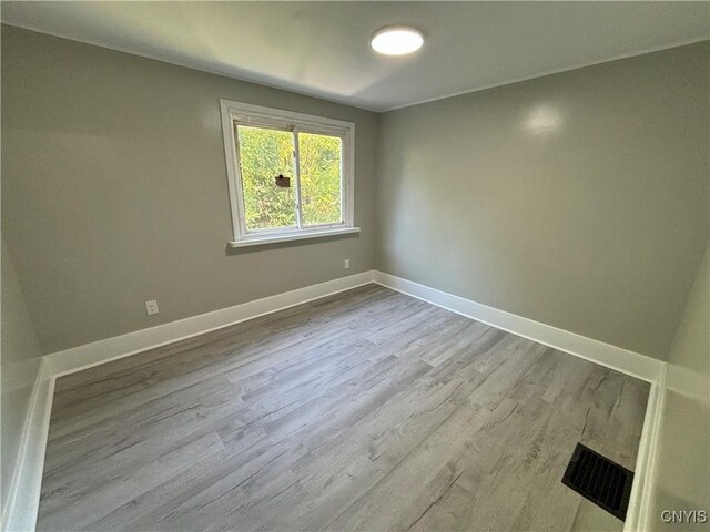 214 Herriman St Unit 216, Syracuse, NY 13204 - empty room with wood finished floors and baseboards
