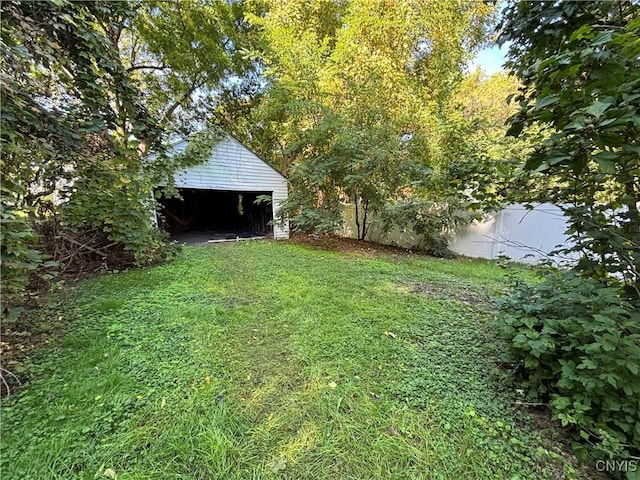 214 Herriman St Unit 216, Syracuse, NY 13204 - view of yard with an outbuilding and a detached garage