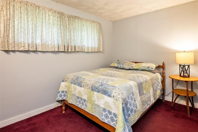 carpeted bedroom with baseboards