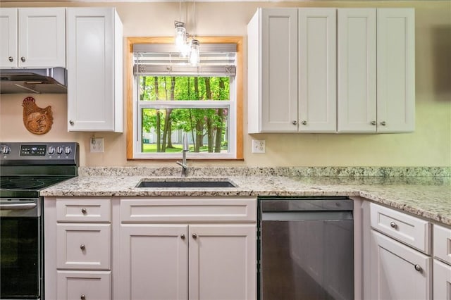 kitchen featuring appliances with stainless steel finishes, under cabinet range hood, a sink, white cabinets, and light stone countertops